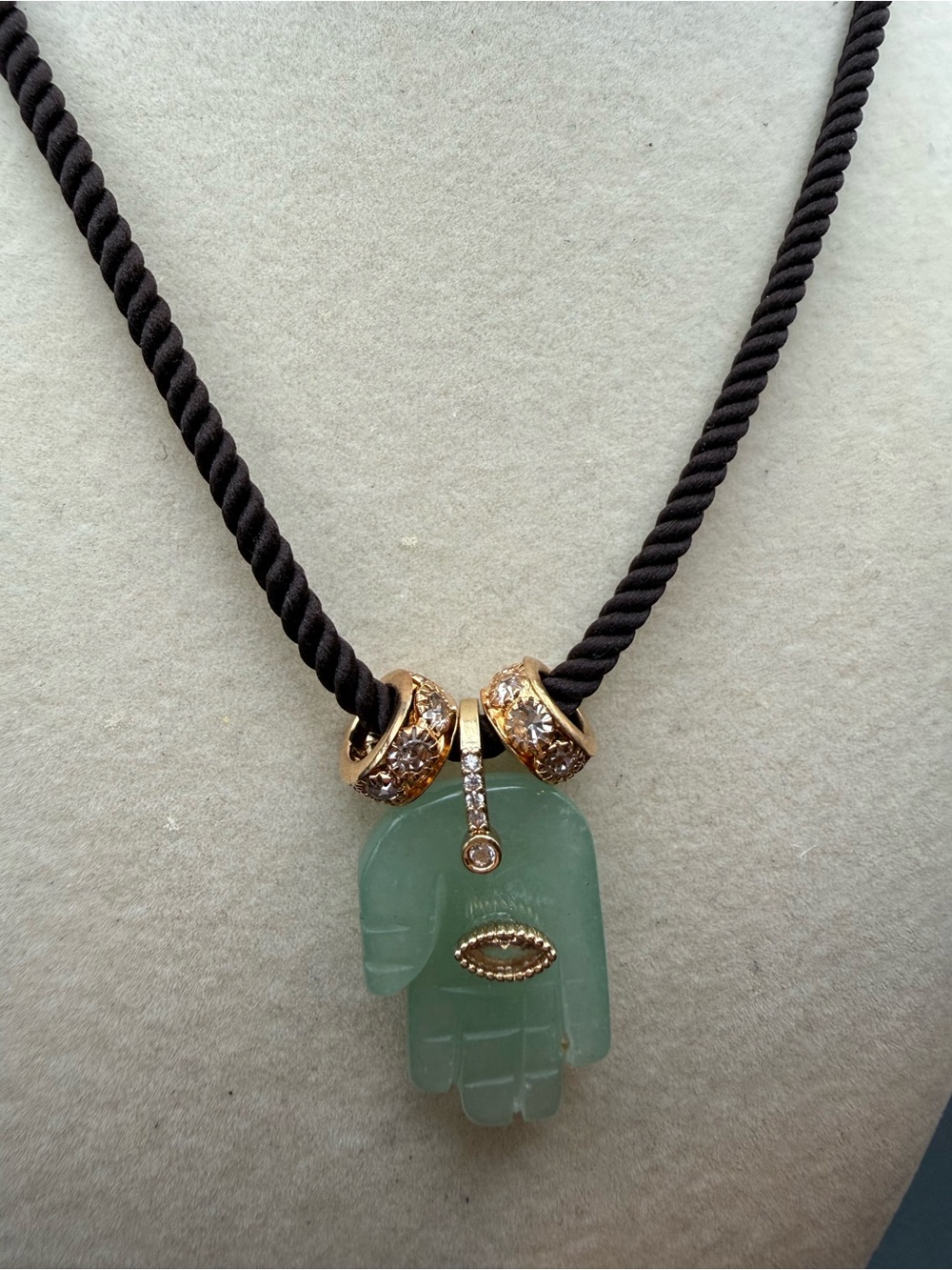 Green Jade Hand Pendant on brown rope Necklace with Gold Accents